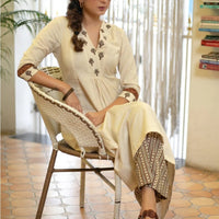 Graceful Off-White Kurta with Embroidered Yoke and Printed Pants